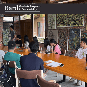 Students at Bard's first camp for environmental education in China gather around a table