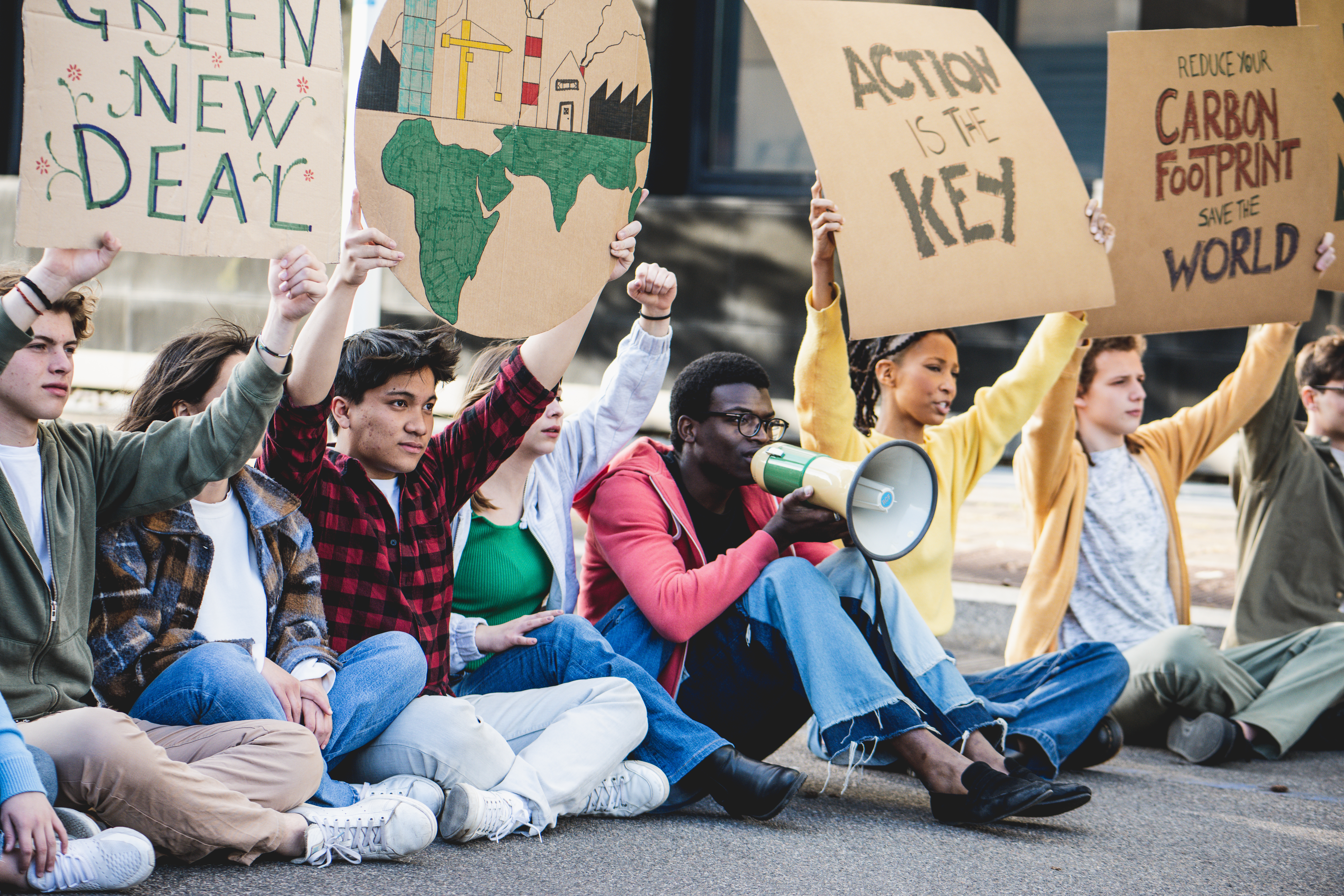 group of young activities against land exploitation and climate change exercise the right to protest and make a sit-in